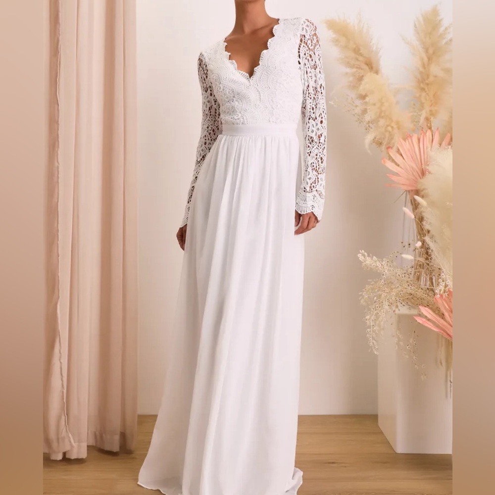 Stunning white gown with lace bodice and open back cutout! Only worn once